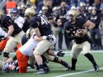 Army QB, A.J. Schurr keeps the TDs rolling, coming off the bench to rush for 2 and throw for the winning score against Bucknell. (Hans Pennink/AP)
